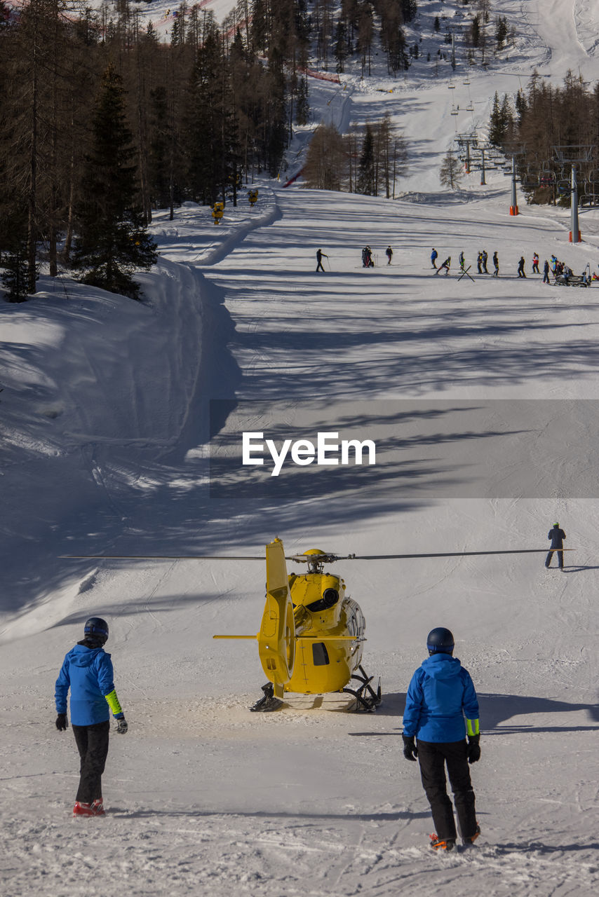 FULL LENGTH OF PEOPLE ON SNOW COVERED STREET