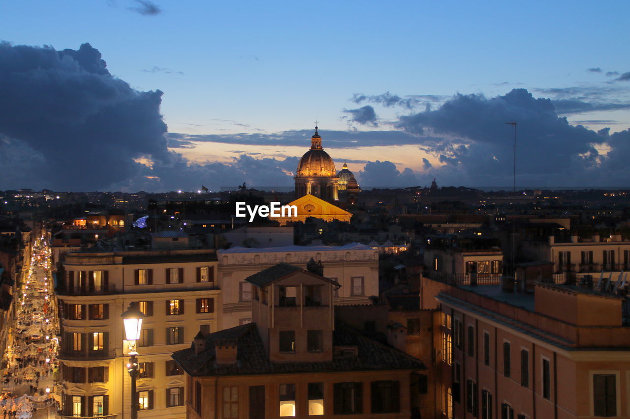 Illuminated buildings in city at night