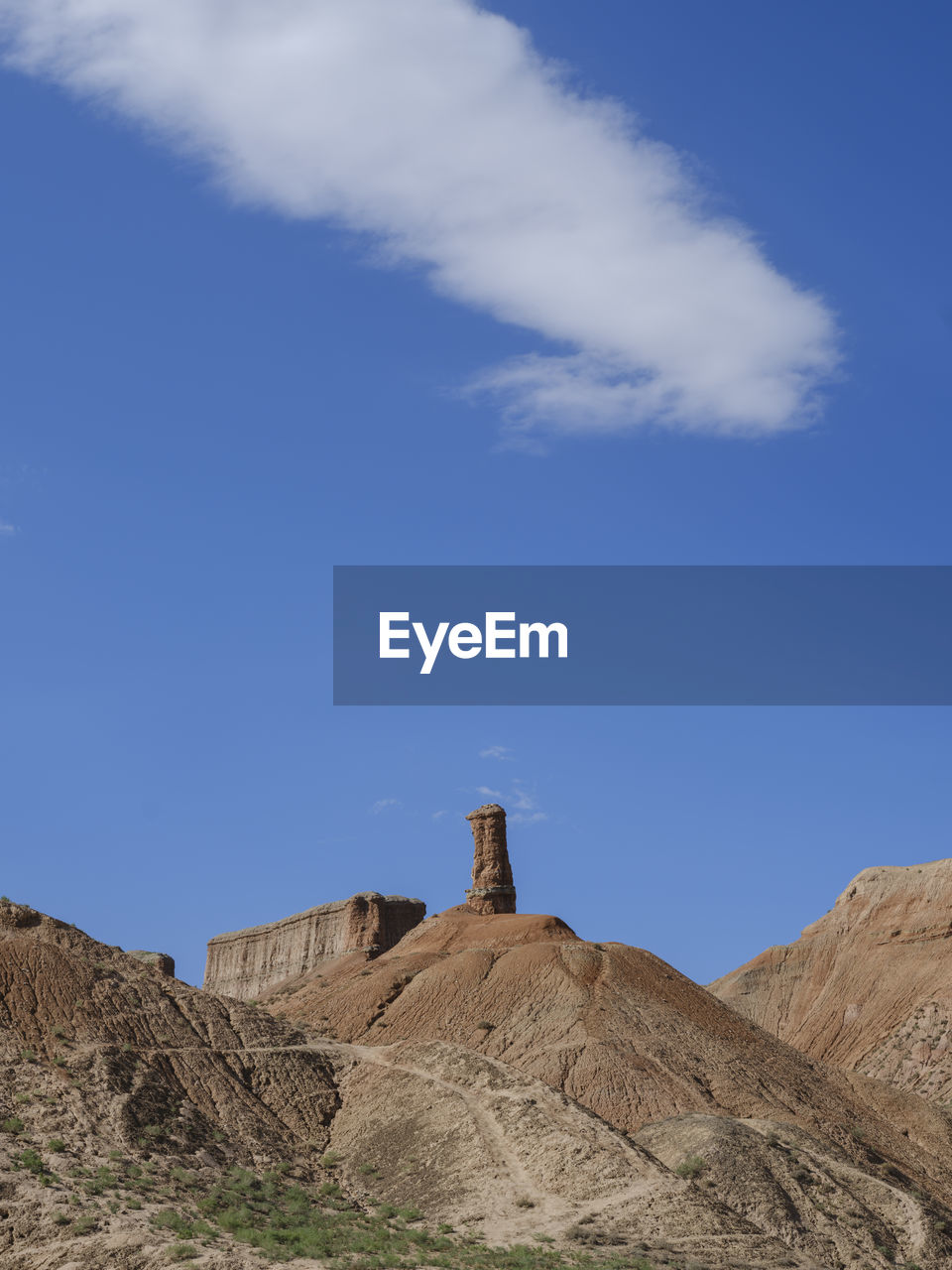 sky, mountain, architecture, built structure, cloud, nature, landscape, environment, blue, building exterior, plateau, rock, scenics - nature, land, no people, day, non-urban scene, history, geology, travel destinations, building, outdoors, the past, travel, tower, natural environment, monument, beauty in nature, low angle view, desert, industry, tranquility
