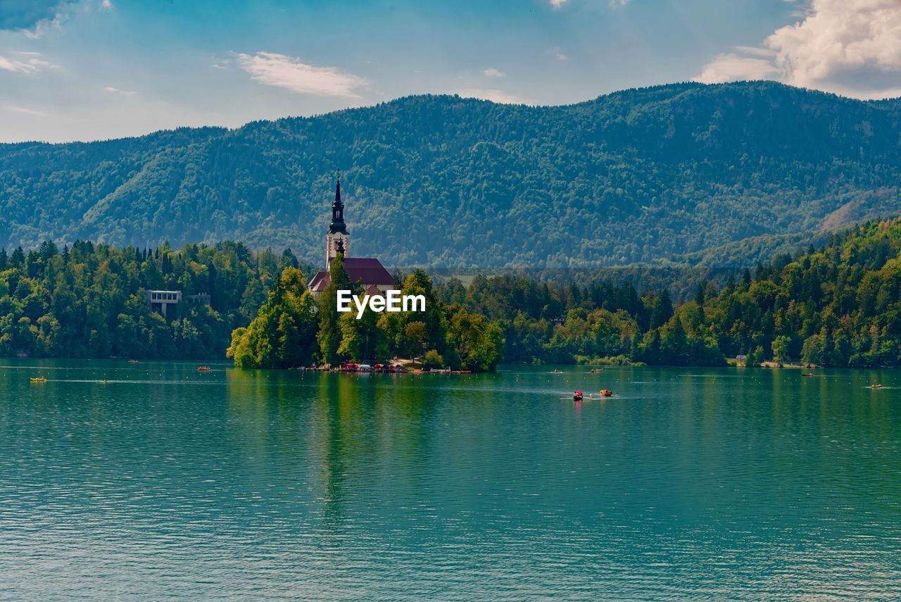 Scenic view of lake against cloudy sky