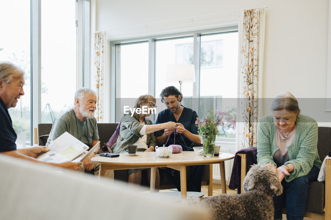 PEOPLE SITTING ON TABLE