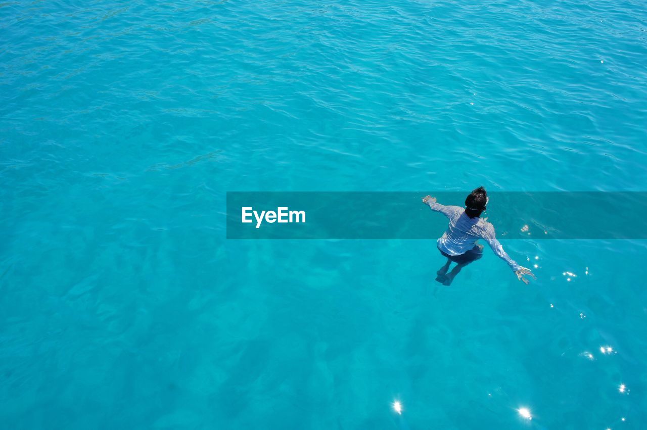 High angle view of person swimming in sea