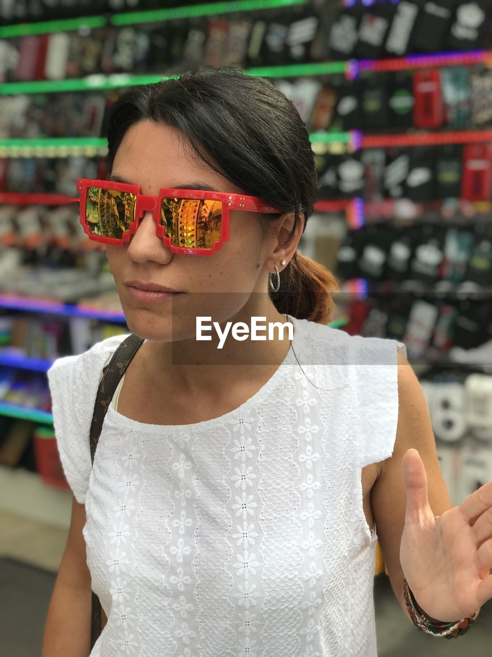 Woman wearing sunglasses at store