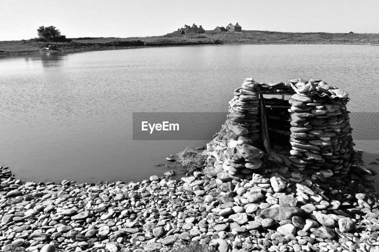 STACK OF STONES IN LAKE