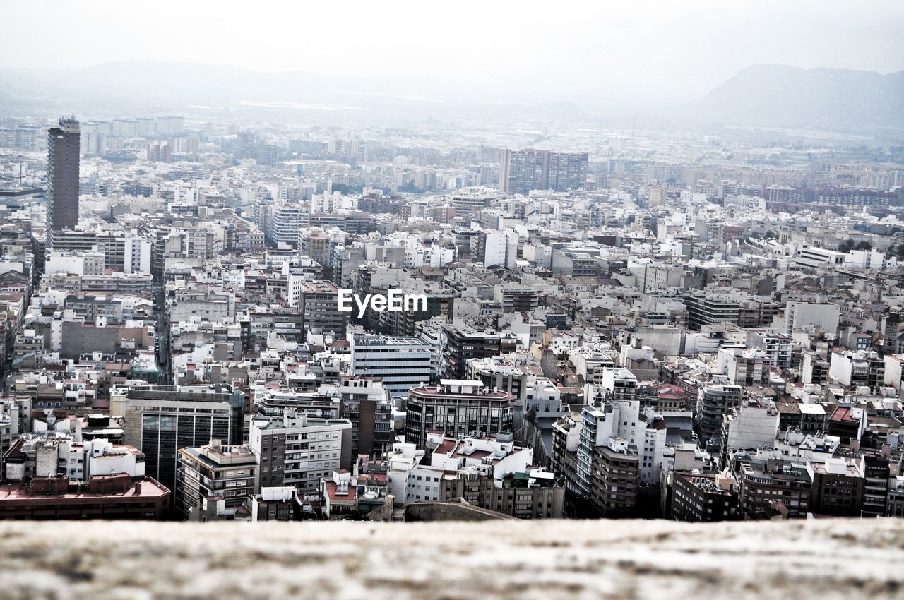 High angle view of buildings in city against clear sky