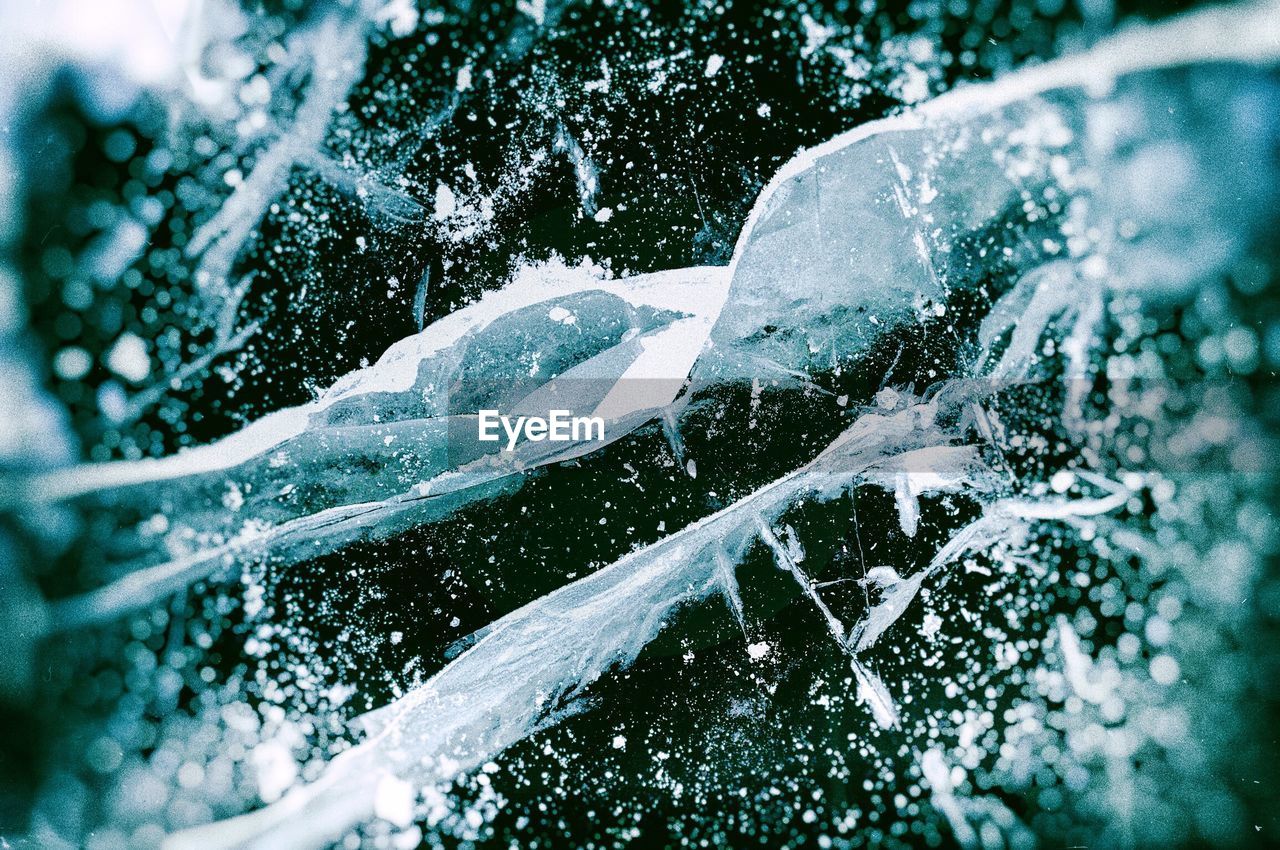 CLOSE-UP OF WATER SPLASHING ON ROCK