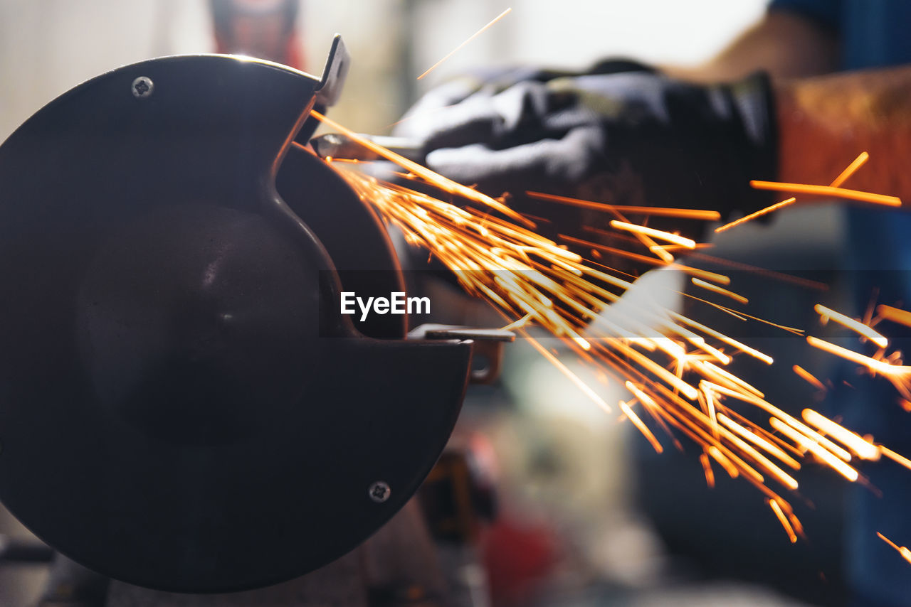 Cropped hand of man working in workshop