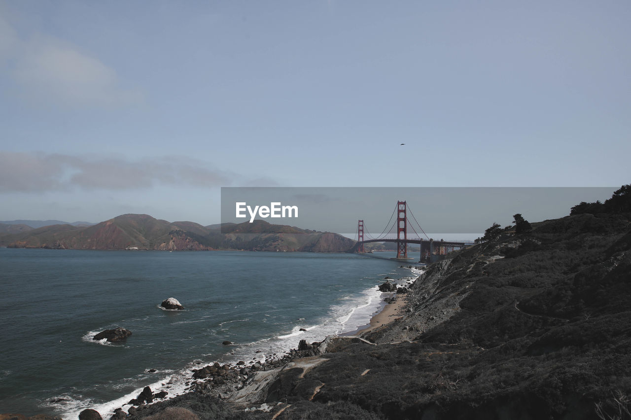 View of suspension bridge over sea