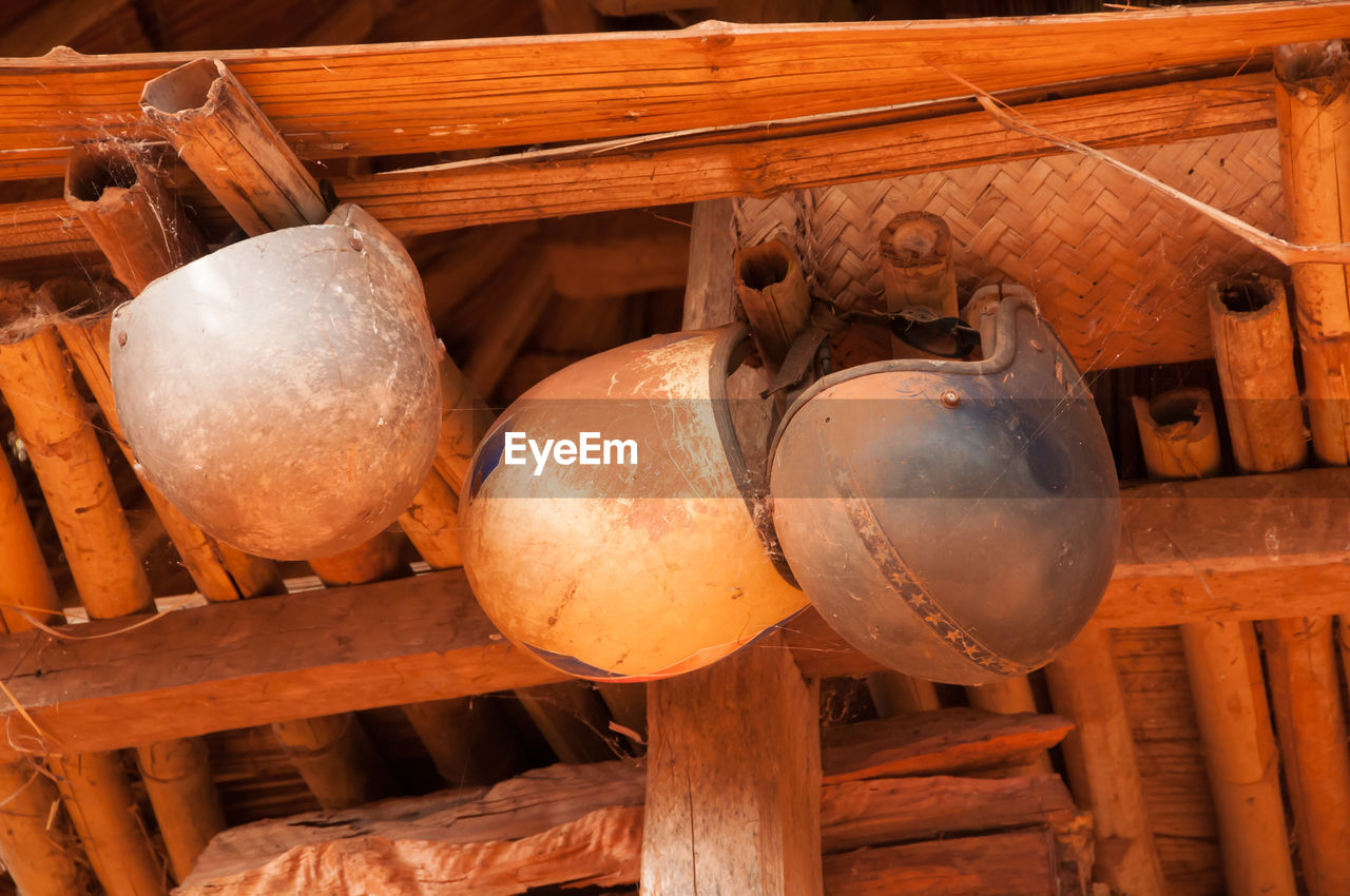 LOW ANGLE VIEW OF OLD RUSTY HANGING ON CEILING