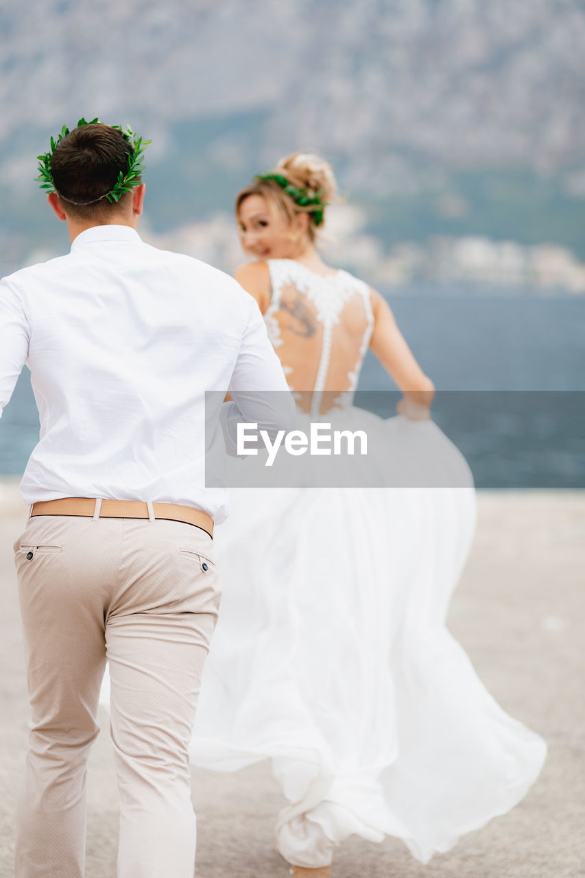 Young couple running outdoors