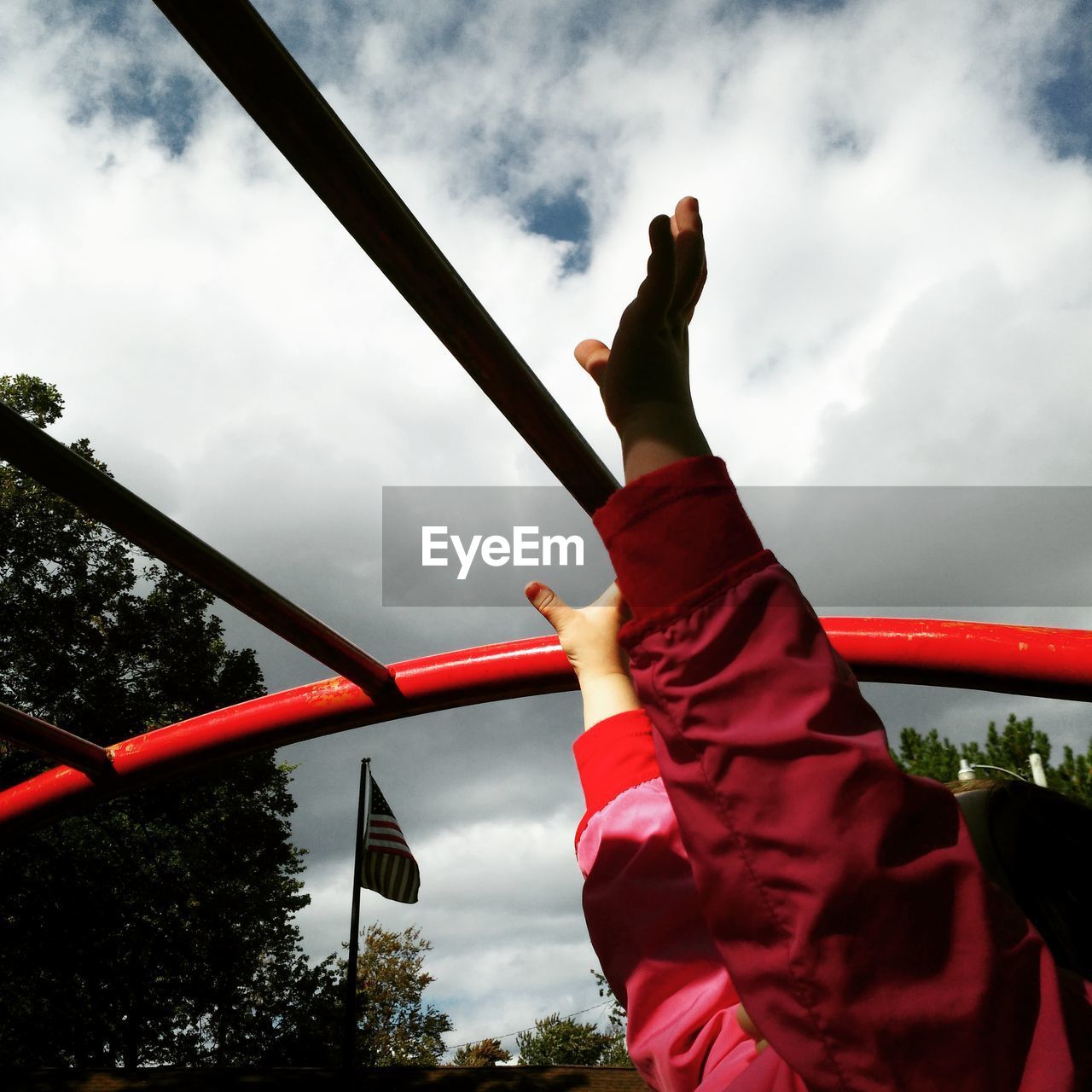 LOW ANGLE VIEW OF MAN AGAINST THE SKY