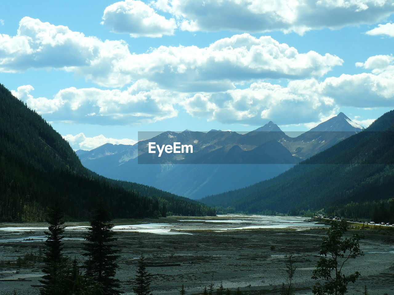 Scenic view of mountains against cloudy sky