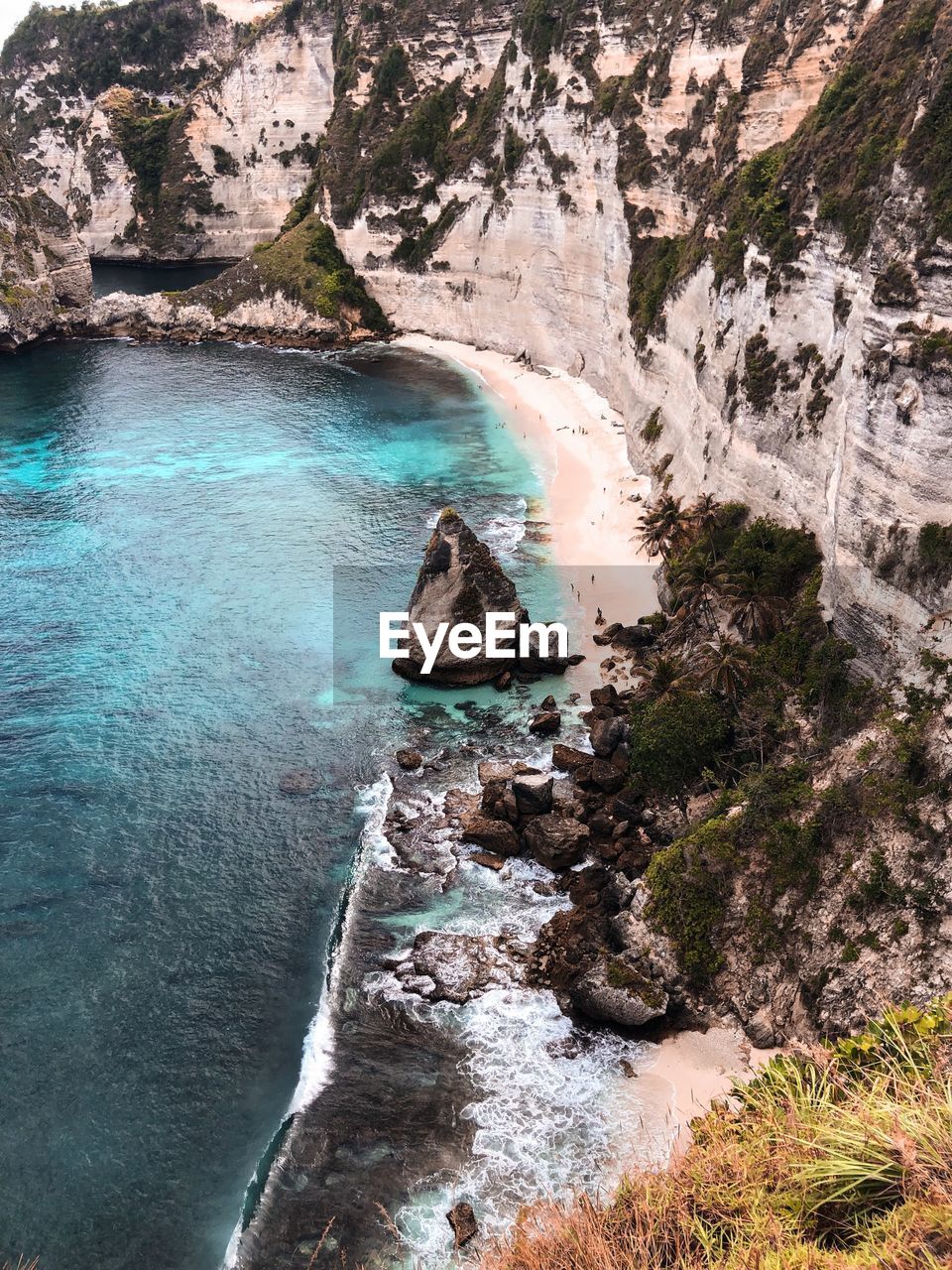 High angle view of water flowing through rocks