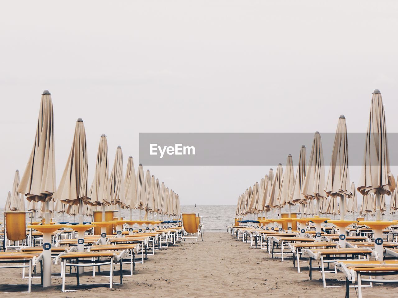 View of empty chairs on beach