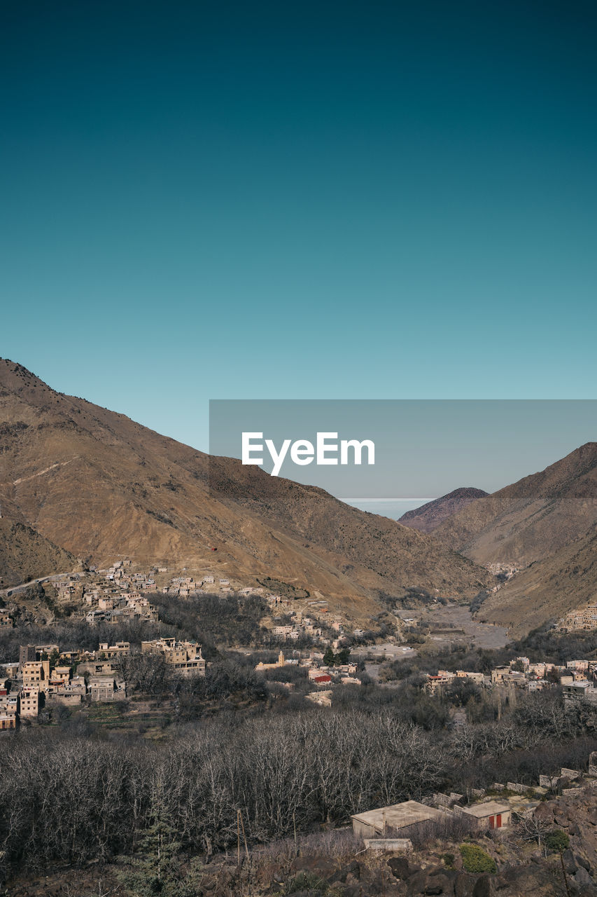 Scenic view of landscape against clear blue sky