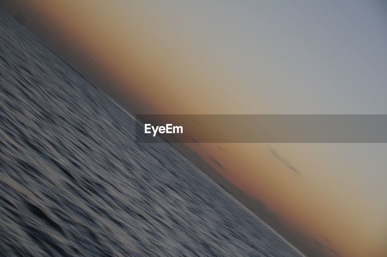 SCENIC VIEW OF SEA WITH TREES IN BACKGROUND