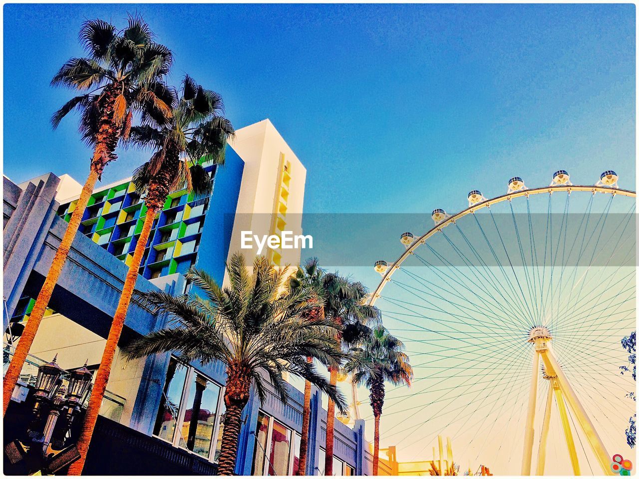 LOW ANGLE VIEW OF FERRIS WHEEL AGAINST CLEAR SKY