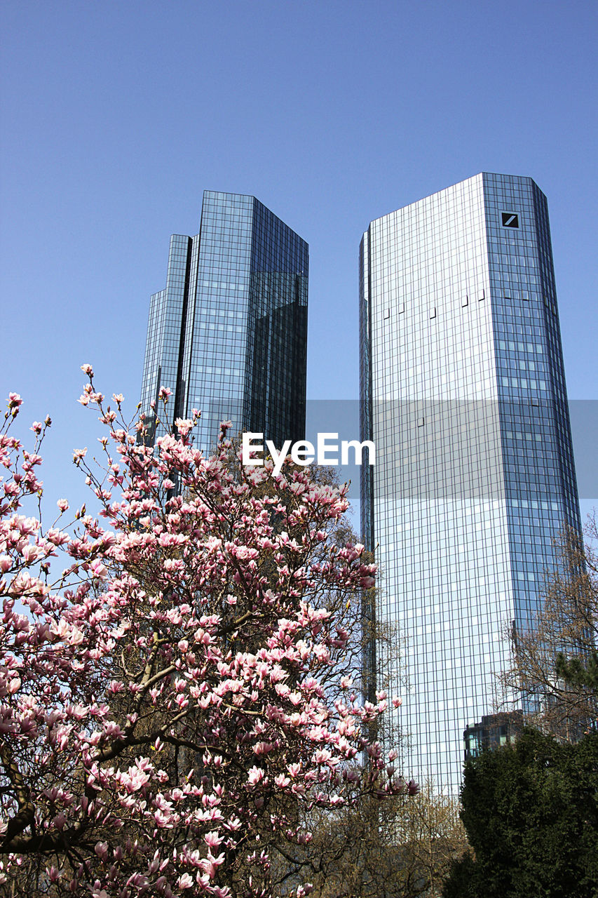 Low angle view of modern building against clear sky