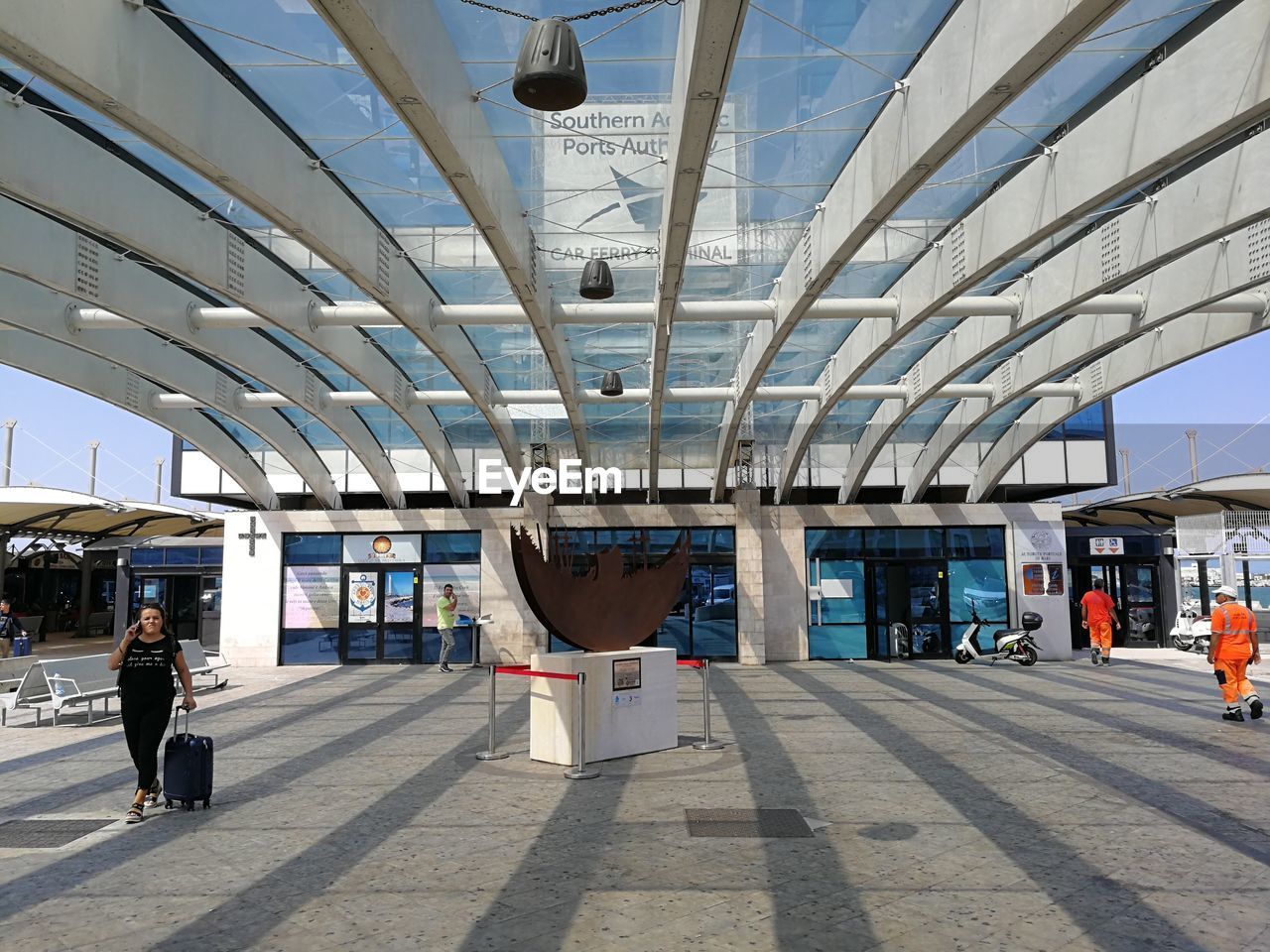 PEOPLE AT RAILROAD STATION PLATFORM