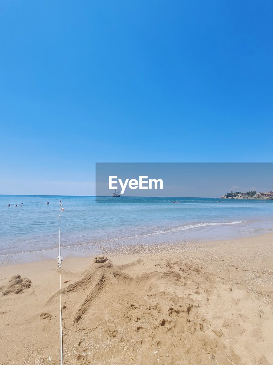 SCENIC VIEW OF BEACH AGAINST CLEAR SKY