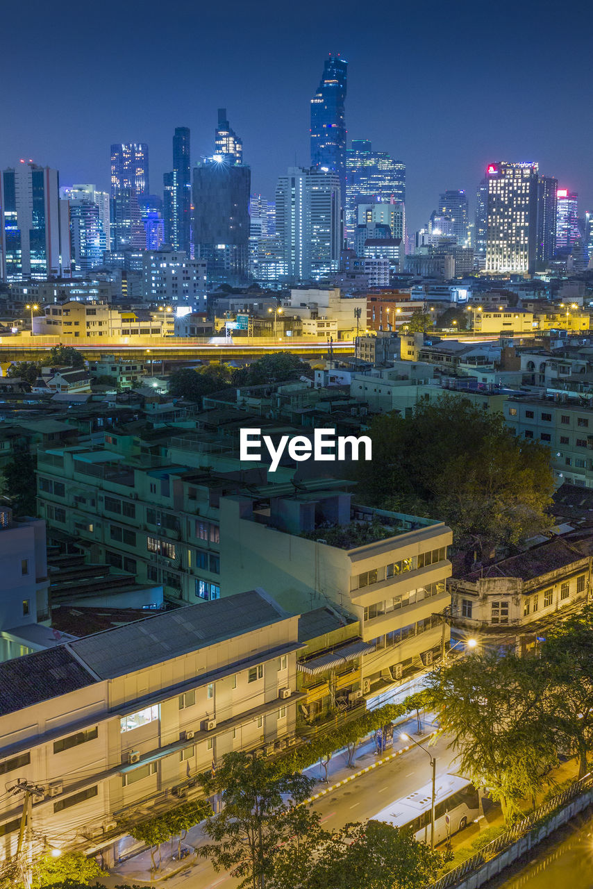 High angle view of illuminated buildings in city at night