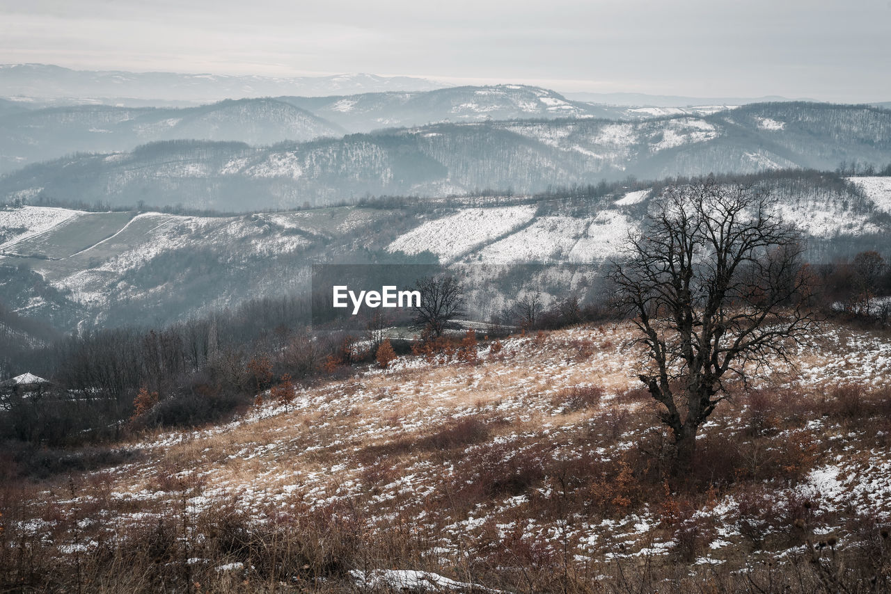 Scenic view of snowcapped mountains against sky