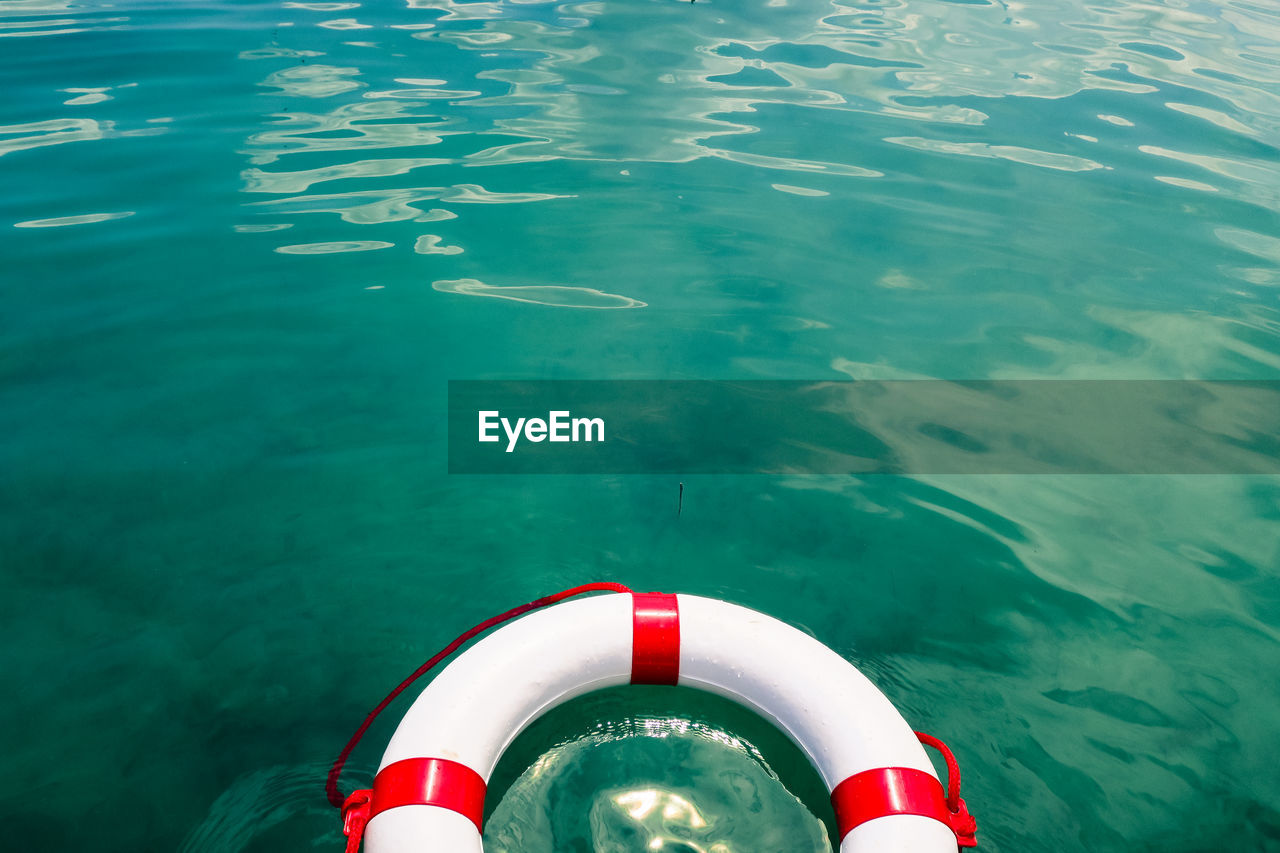 High angle view of lifeguard ring floating at lake