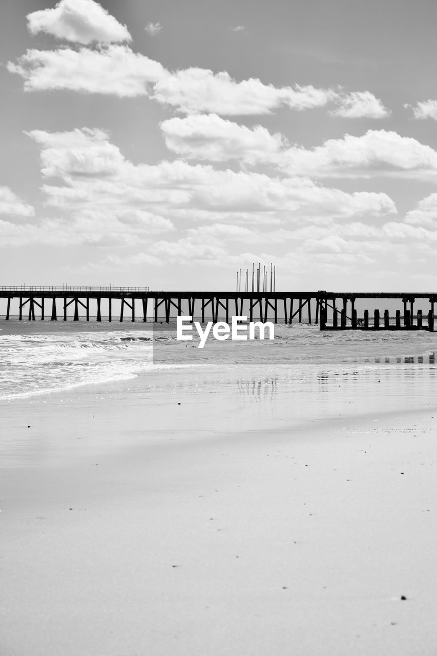 VIEW OF BRIDGE OVER SEA AGAINST SKY