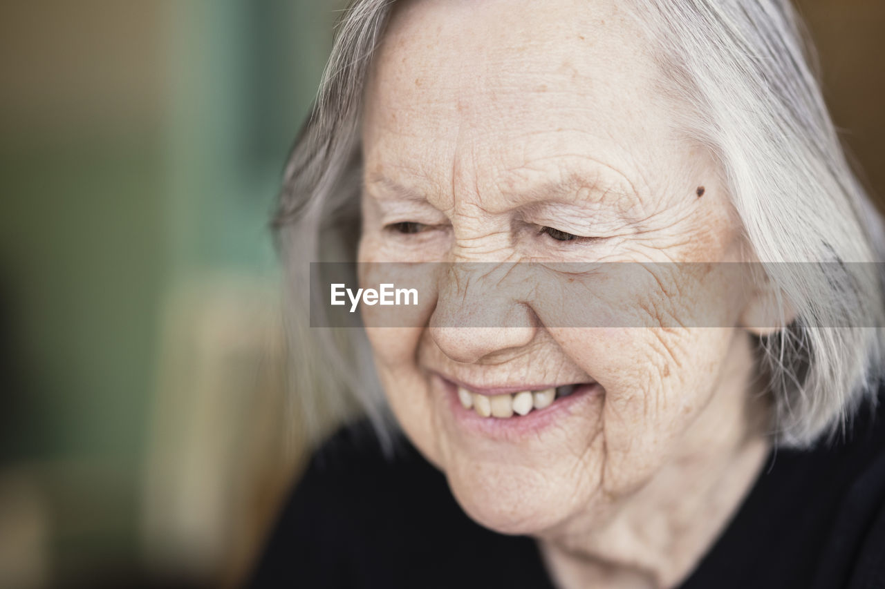 Close-up of smiling senior woman at nursing home