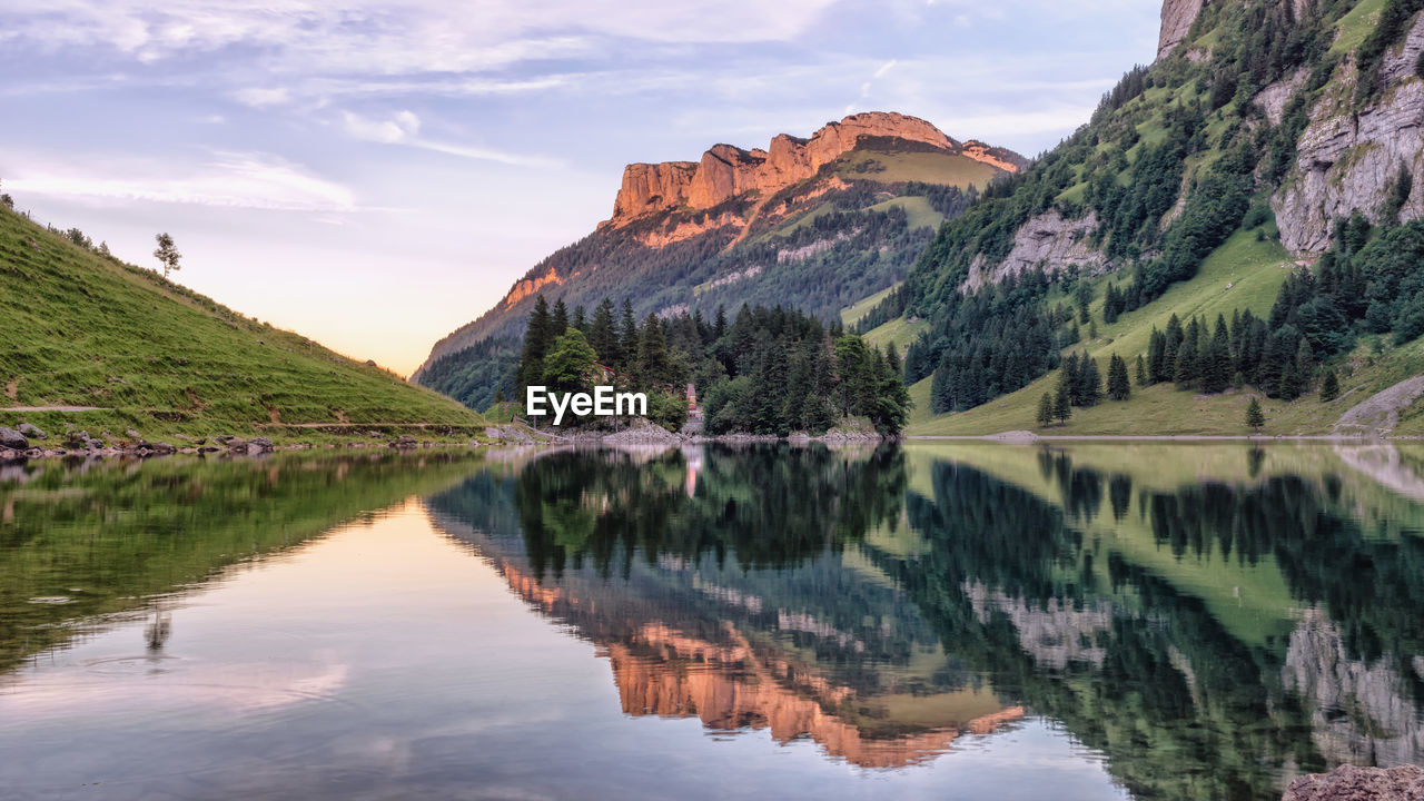 Reflection of mountain in lake against sky