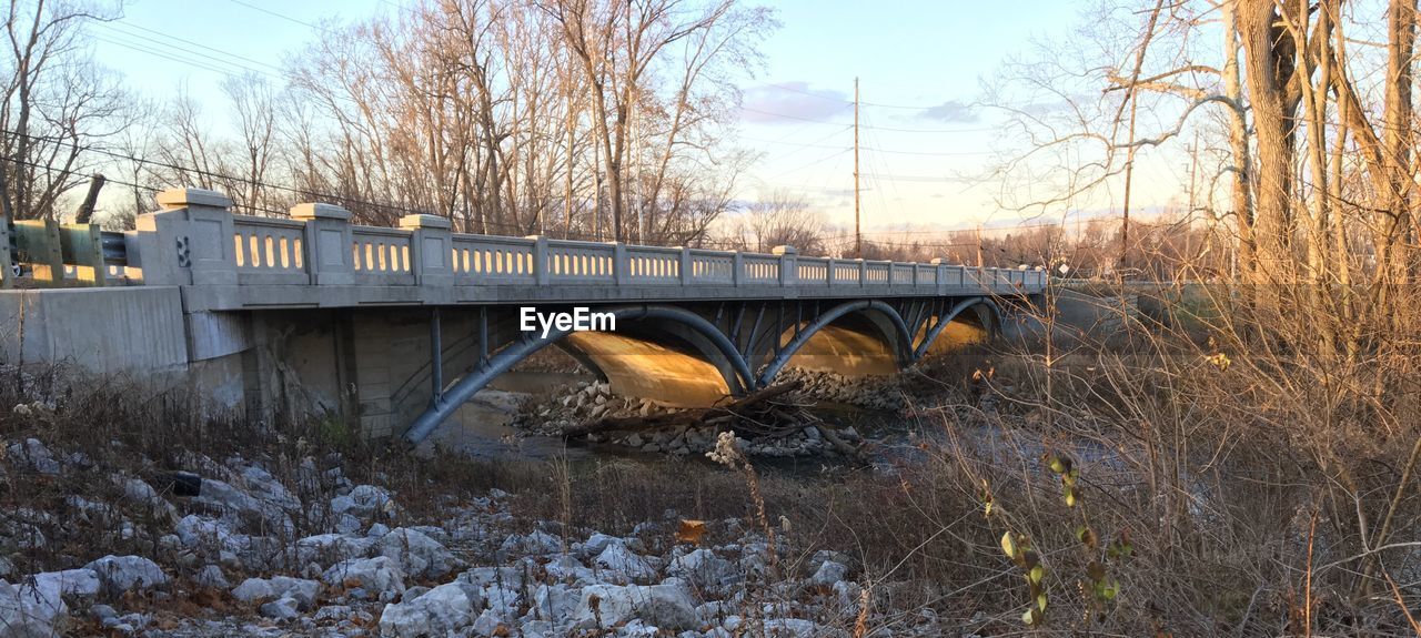 ARCH BRIDGE OVER SNOW COVERED LANDSCAPE