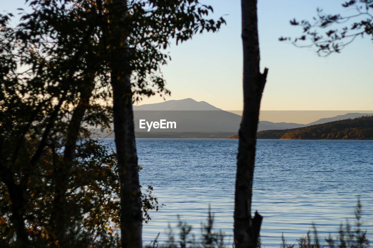 Scenic view of lake against sky during sunset