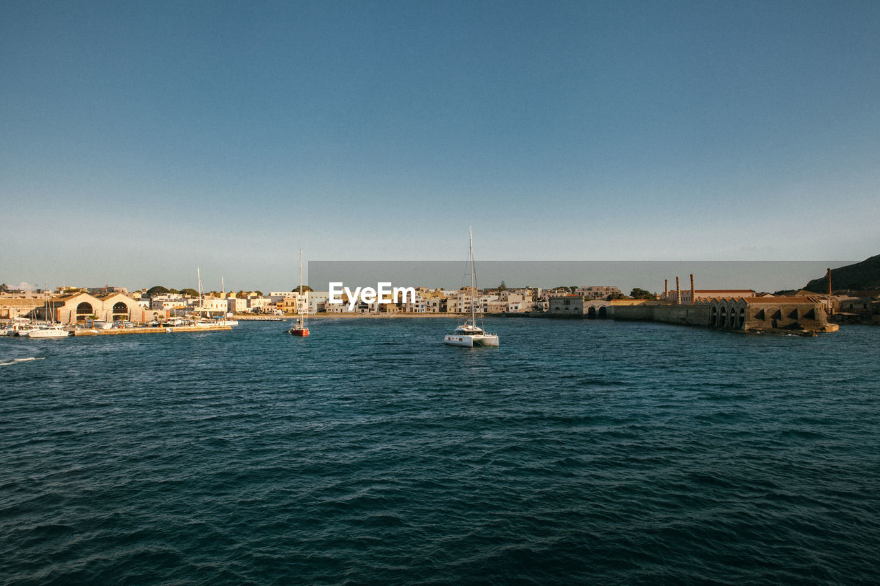 Sea view on the port, old buildings.