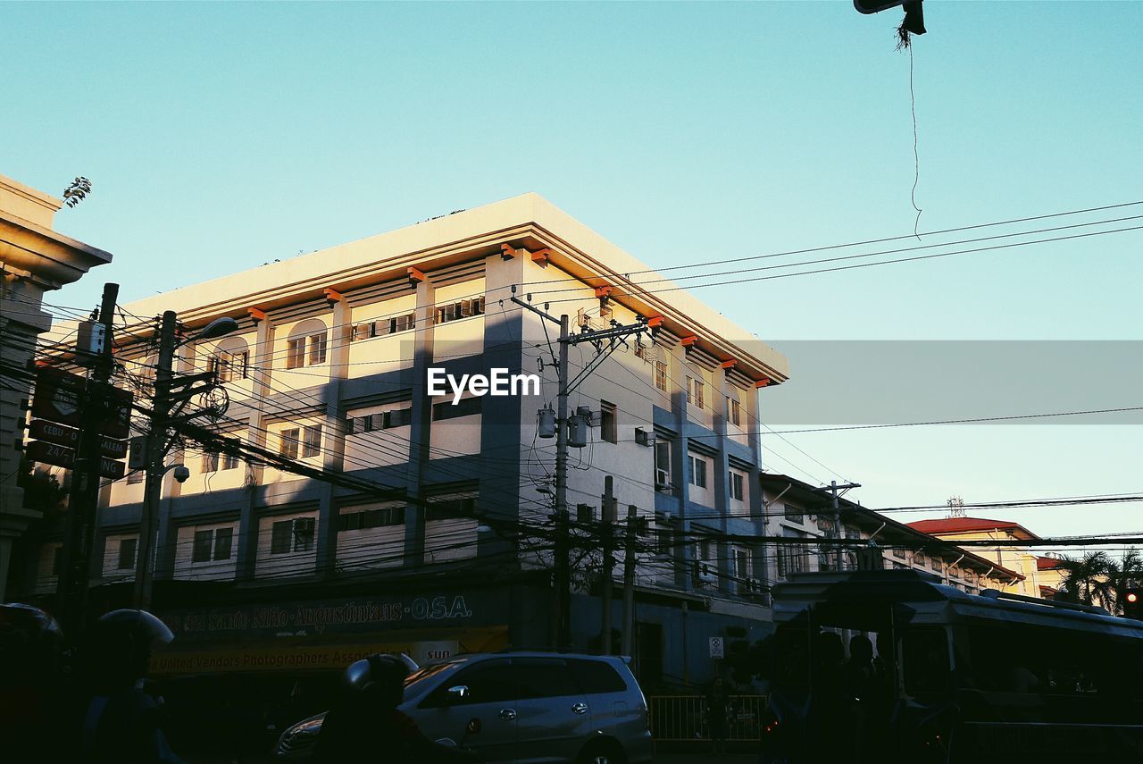 LOW ANGLE VIEW OF BUILDINGS AGAINST CLEAR SKY