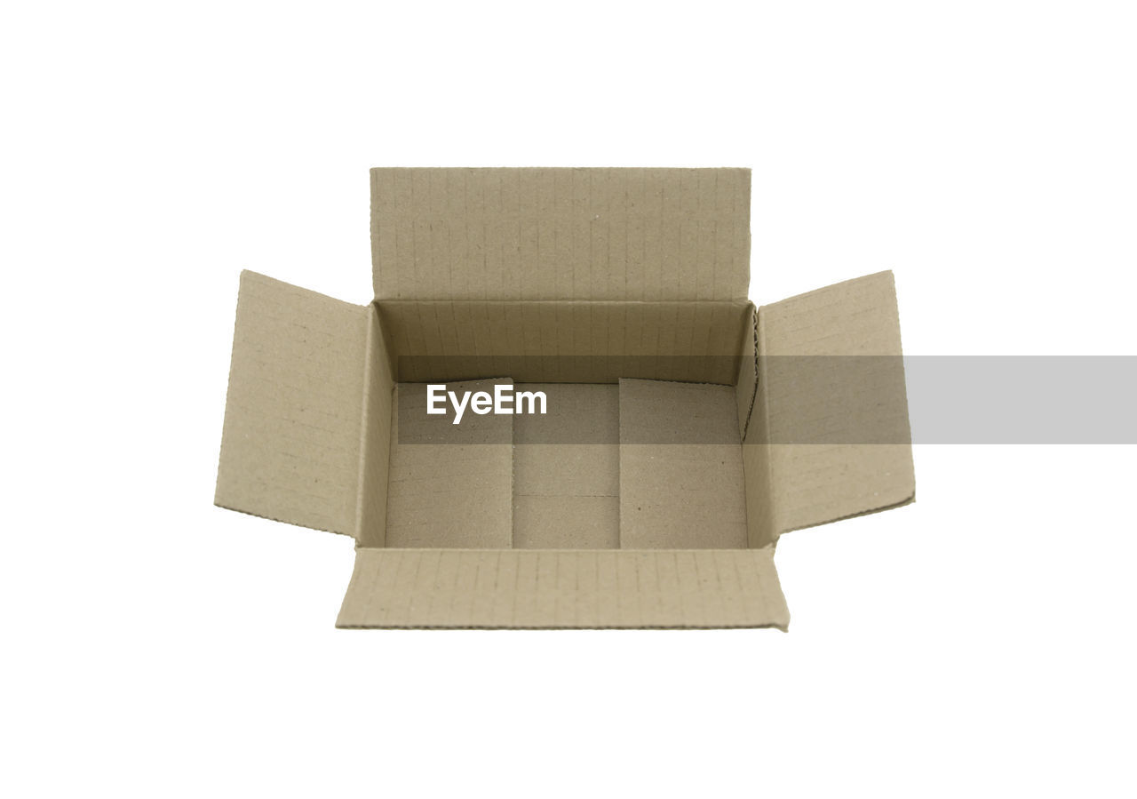 cardboard, box, cut out, white background, cardboard box, home ownership, paper, rectangle, container, indoors, furniture, wood, single object, studio shot, no people, white, copy space, package, industry, gift, freight transportation