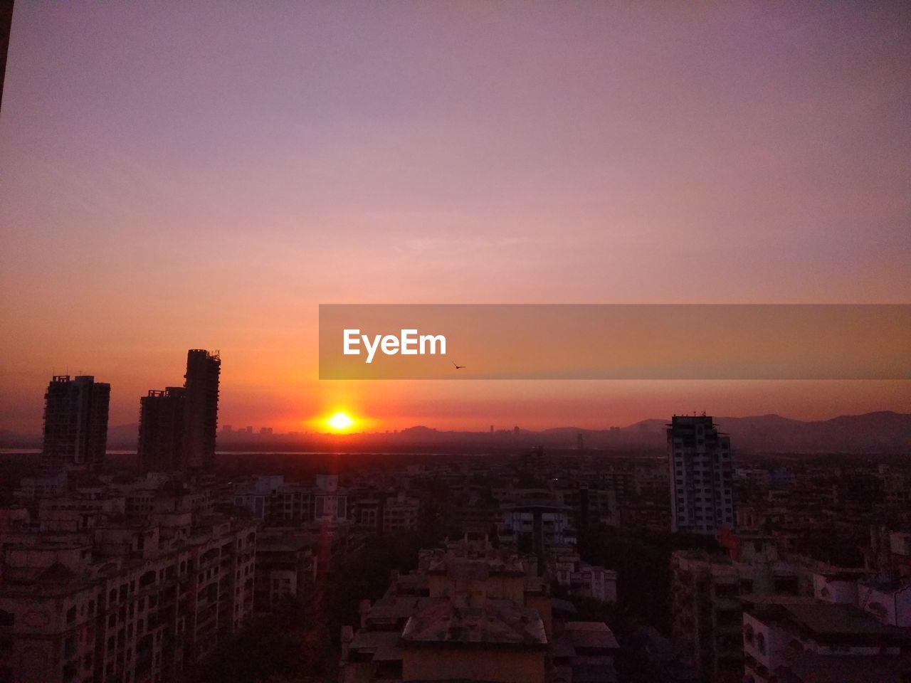 High angle view of cityscape during sunset