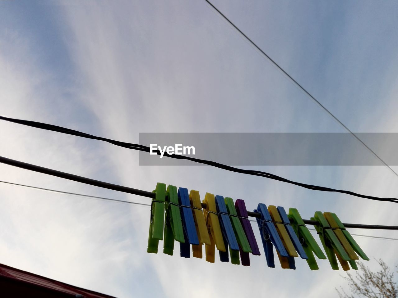 LOW ANGLE VIEW OF CLOTHES HANGING ON CLOTHESLINE