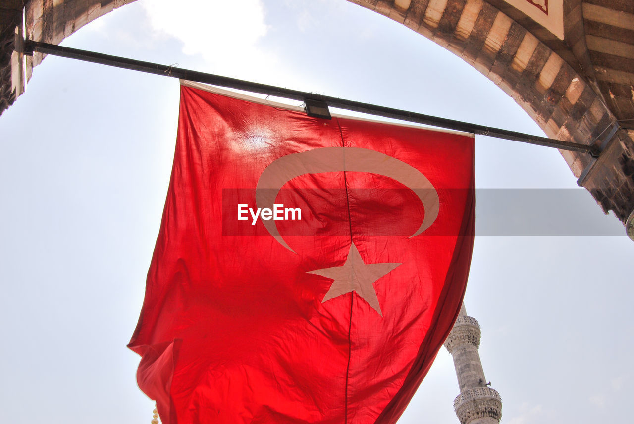 Low angle view of turkey flag against the sky