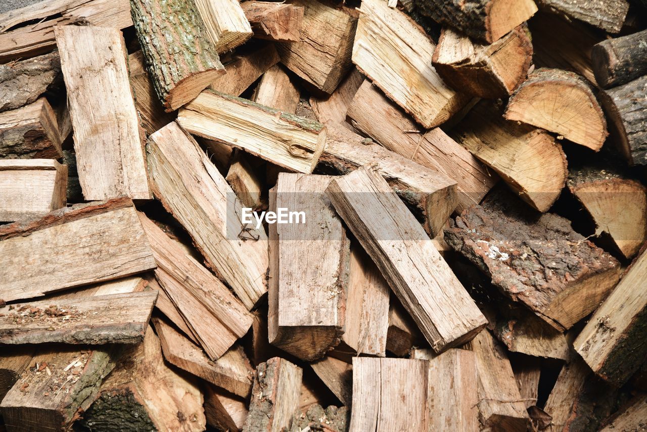 Full frame shot of logs in forest