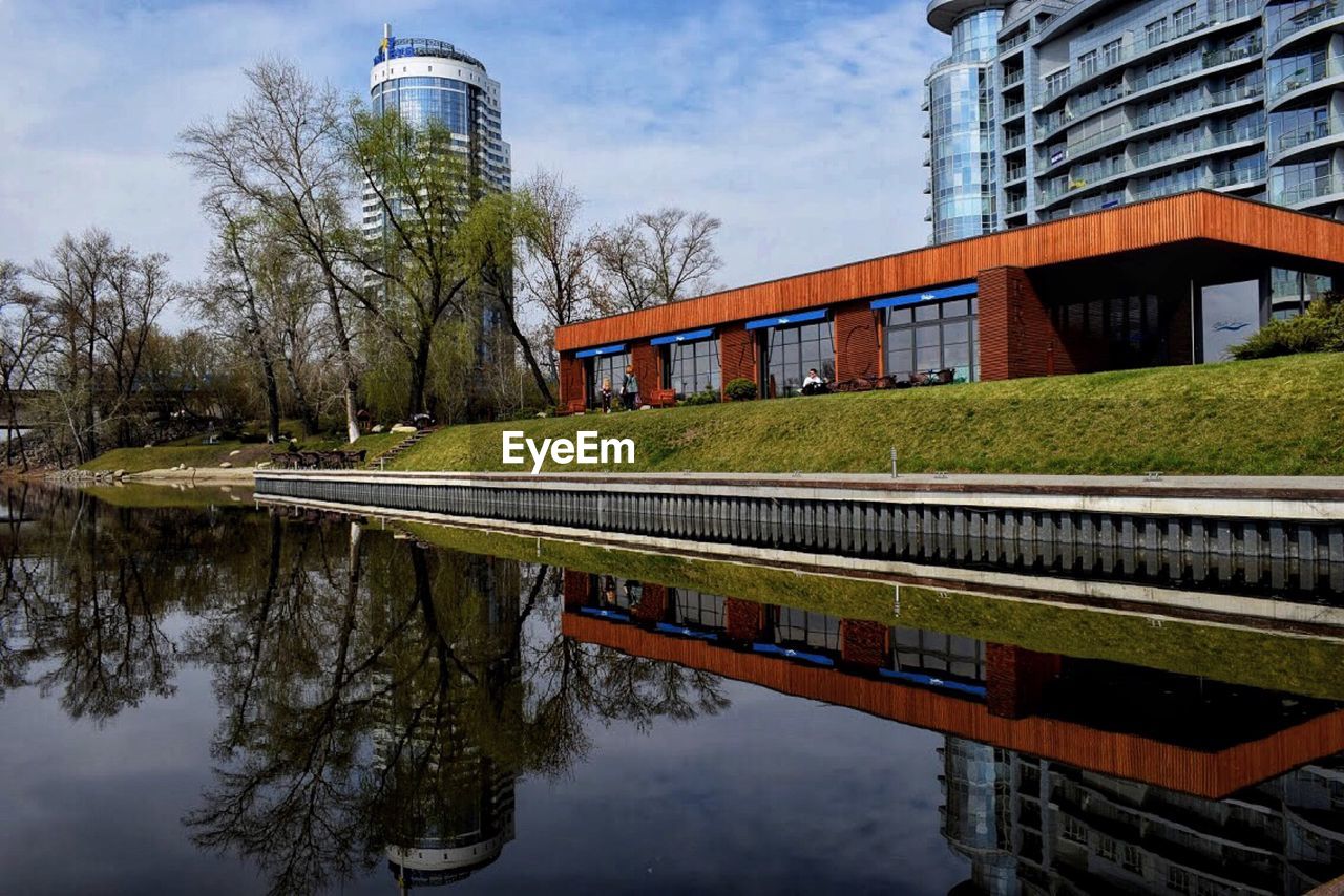 REFLECTION OF BUILDING IN LAKE