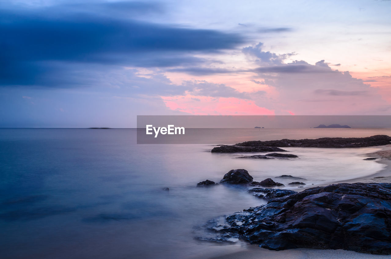 Scenic view of sea against sky at sunset