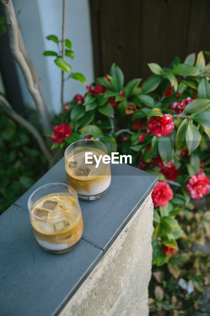 High angle view of coffee glass on table