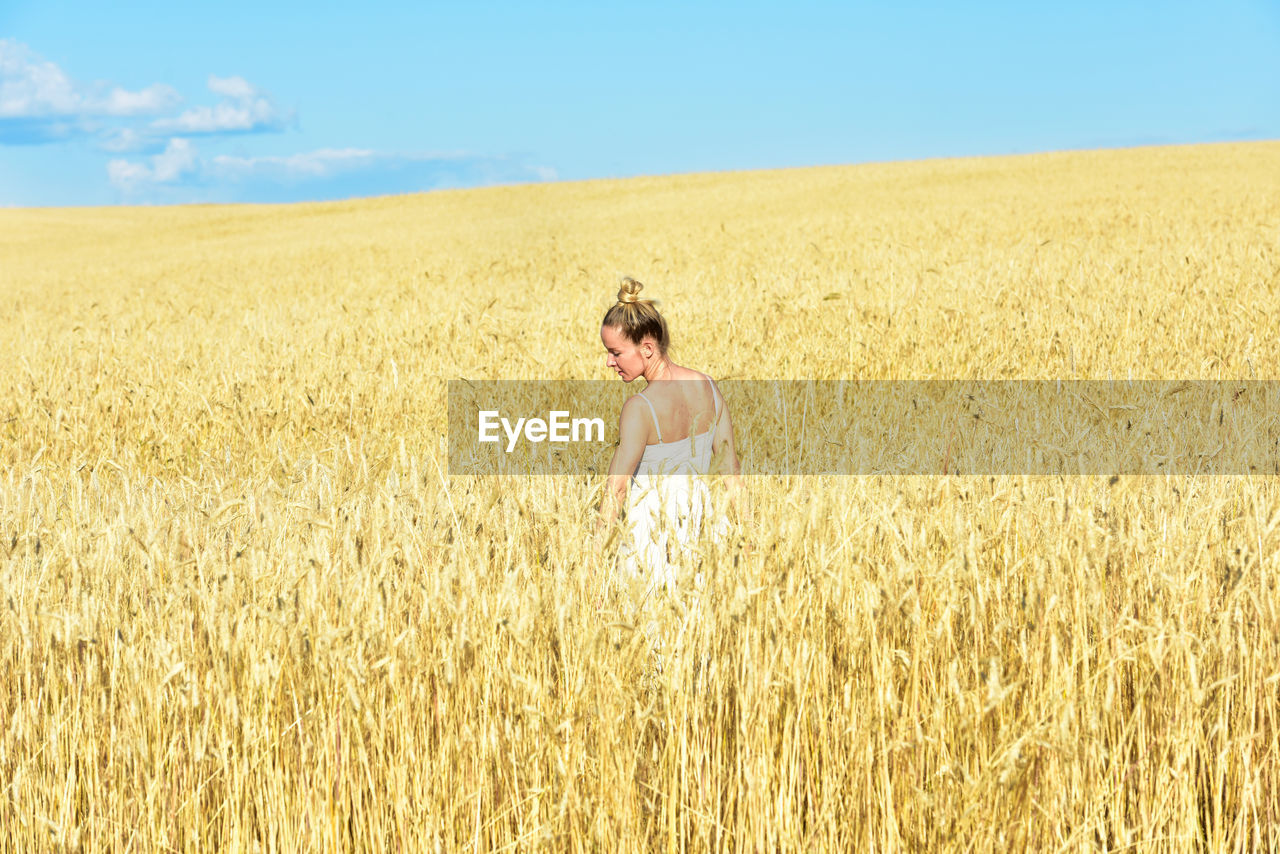 Full length of man standing in field