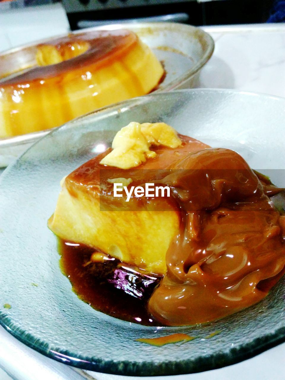 CLOSE-UP OF ICE CREAM IN PLATE WITH SAUCE