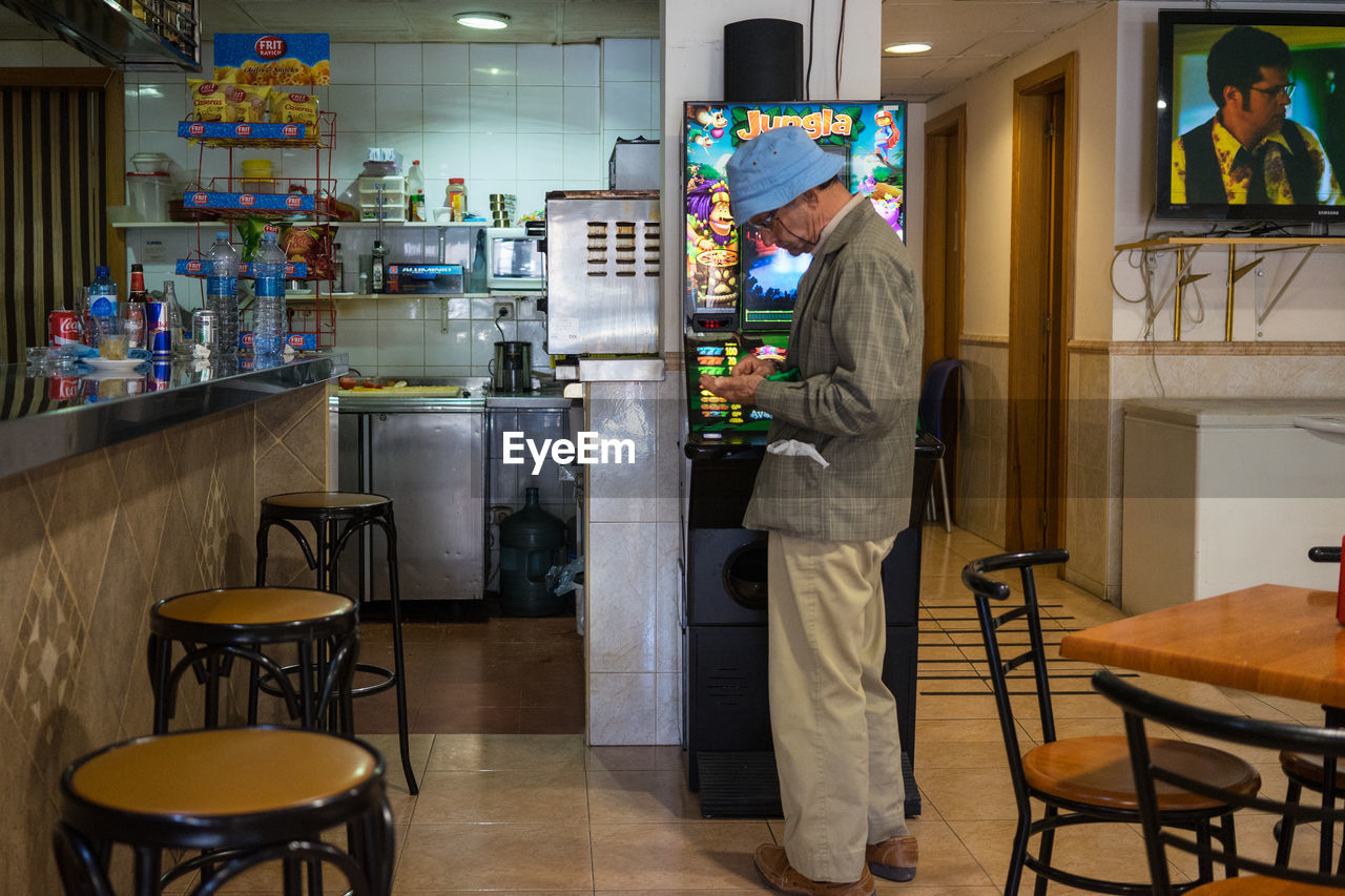 MAN WORKING IN RESTAURANT