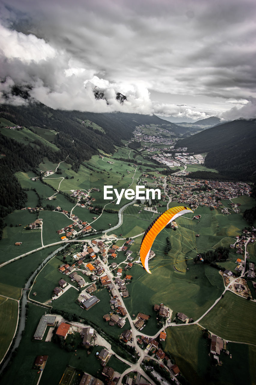 Aerial view of landscape against sky, paragliding.