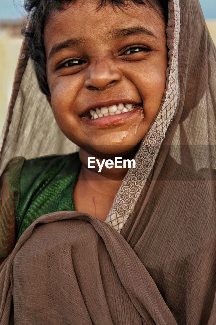 Close-up portrait of smiling girl