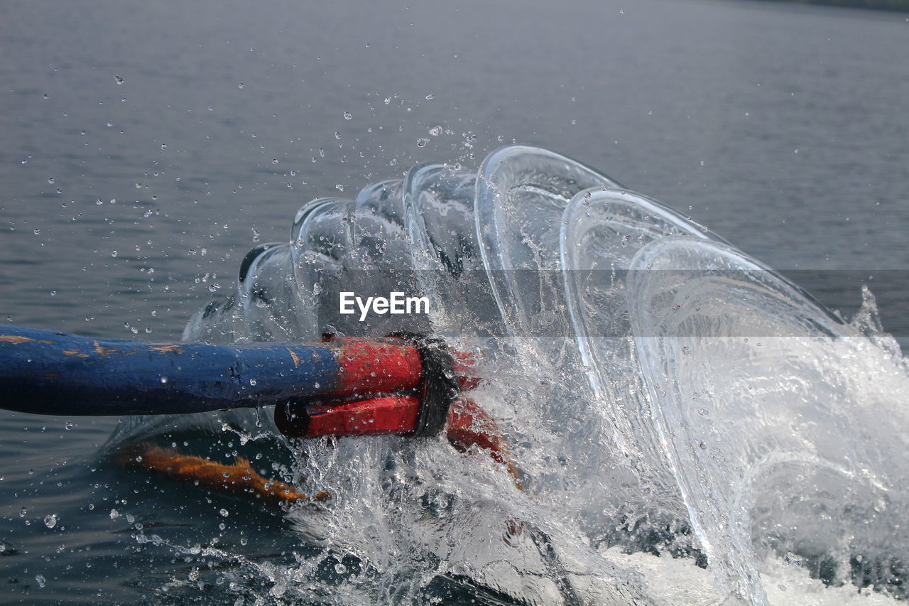 Man splashing water in sea