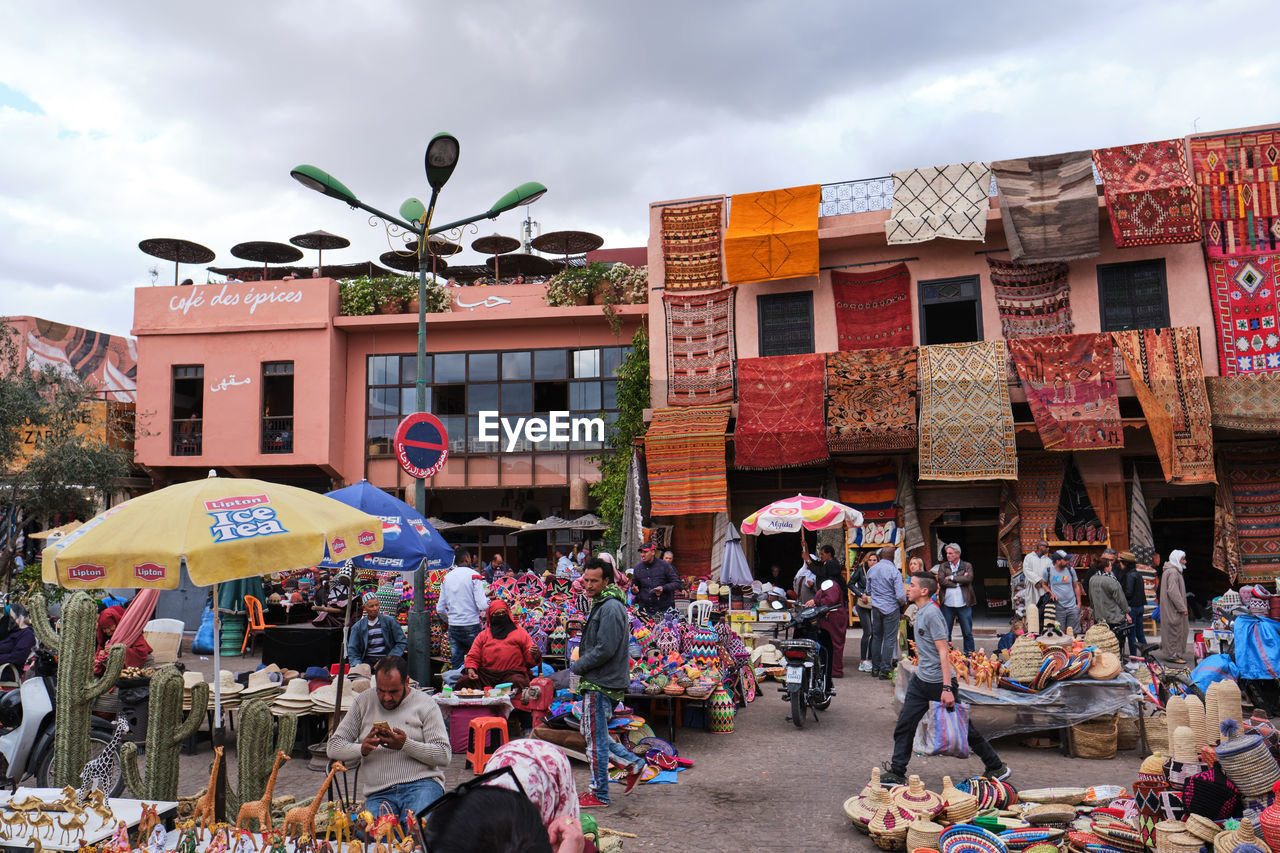 GROUP OF PEOPLE IN MARKET