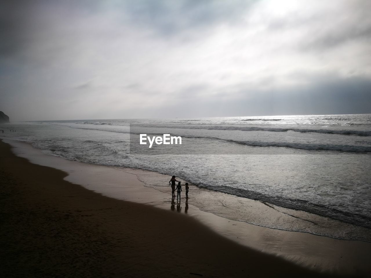 Scenic view of beach against sky during sunset